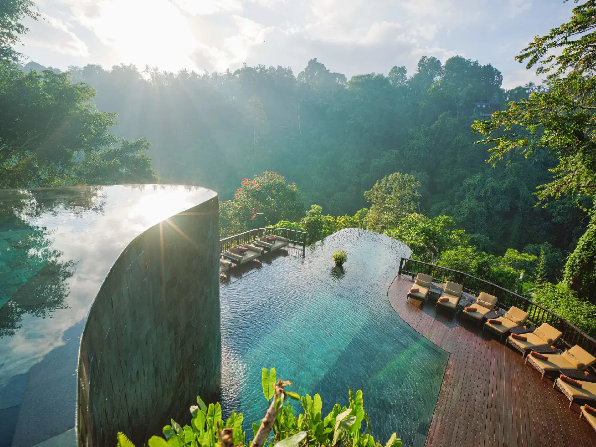 Hanging Gardens of Bali infinity pool overlooking lush rainforest in March green season