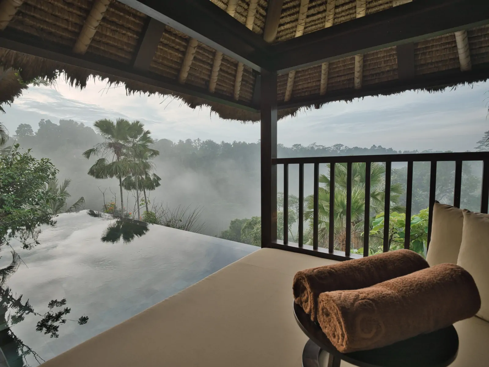 Tropical rainfall in Bali during March viewed from luxury private pool villa