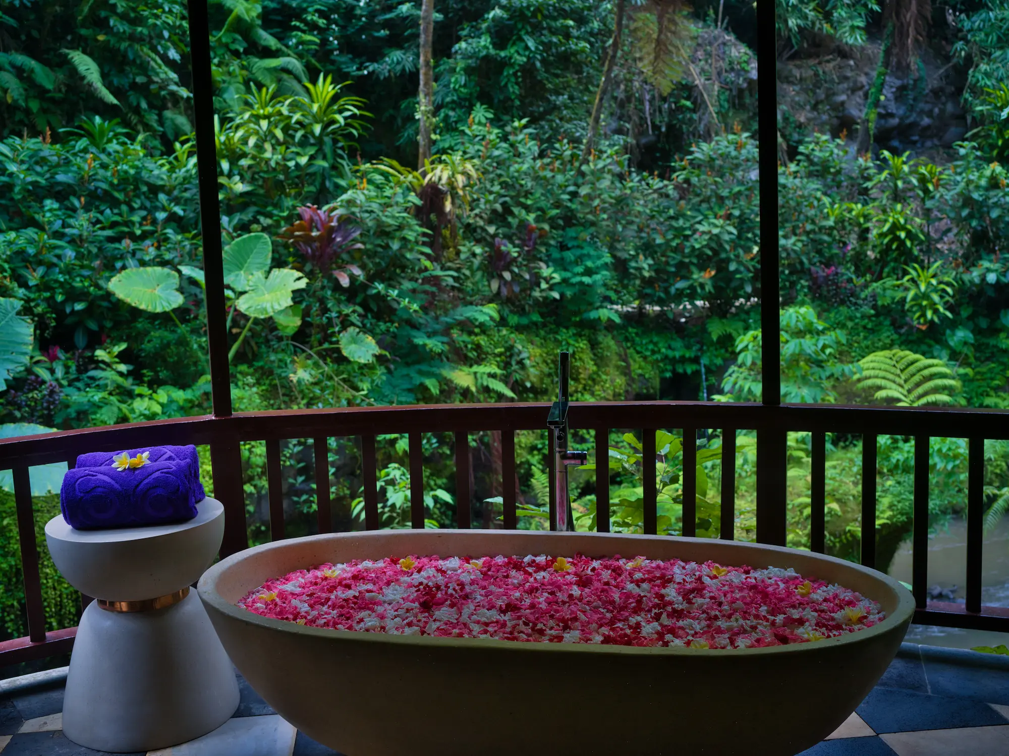 Luxury wellness retreat in Ubud with jungle valley views, riverside spa pavilions, and authentic Balinese healing rituals.