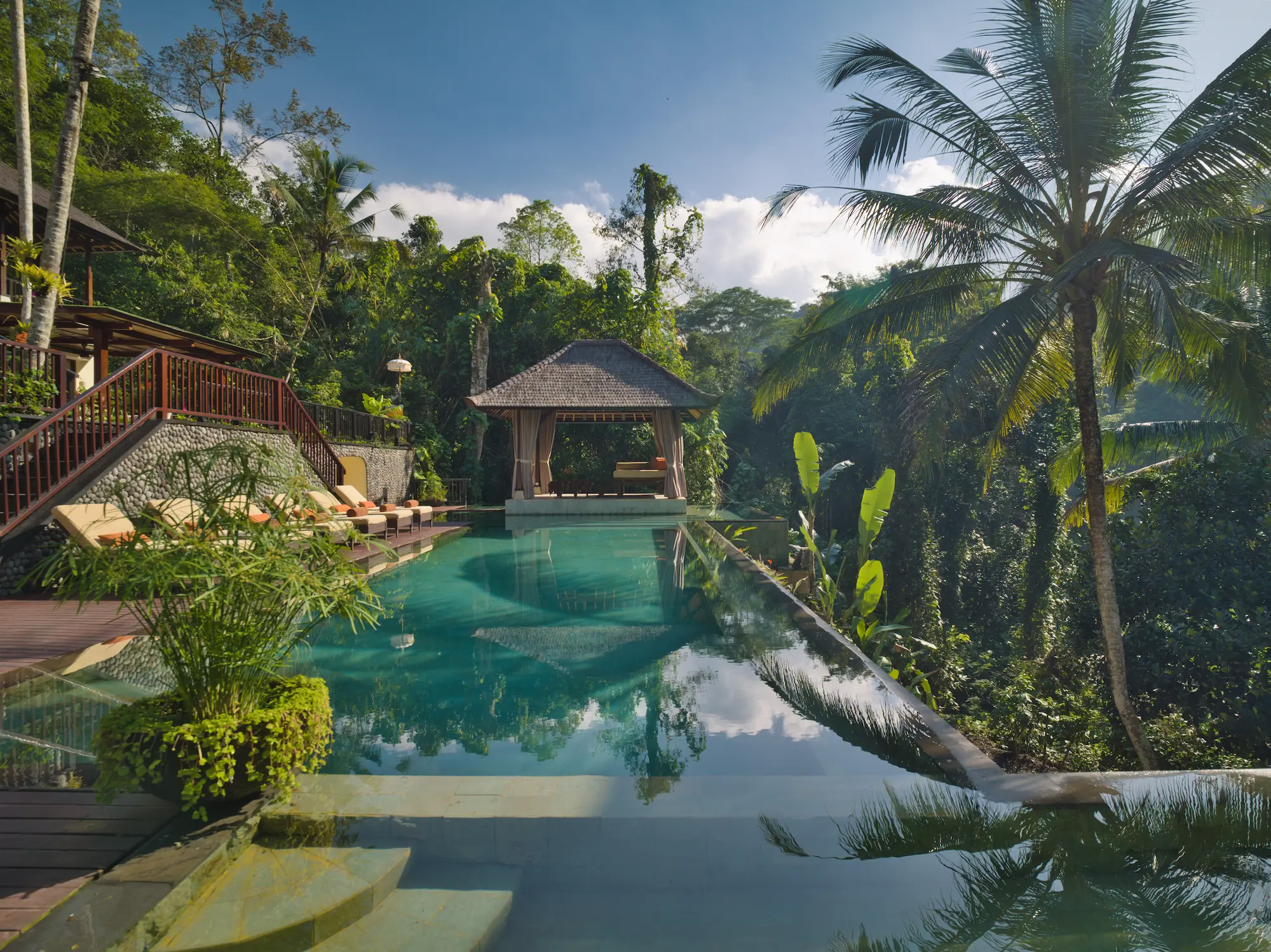 Private full-length infinity pool with island cabana and jungle views at The Hidden Palace Bali