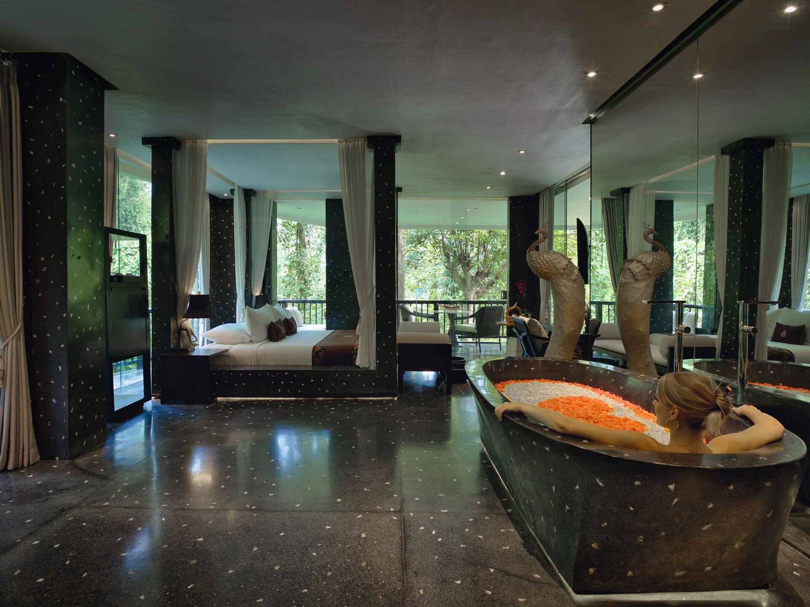 Royal Spa Suite at Hanging Gardens of Bali with private jungle views, luxury king-size bed, in-suite massage room, and exclusive riverside spa experience in Ubud.