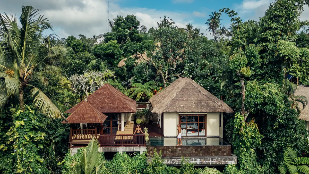 Couple enjoying private jungle villa in Ubud with infinity pool and lush surroundings