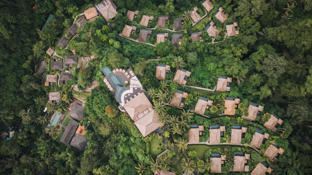 Ubud jungle resort villas integrated into rainforest canopy Hanging Gardens Bali