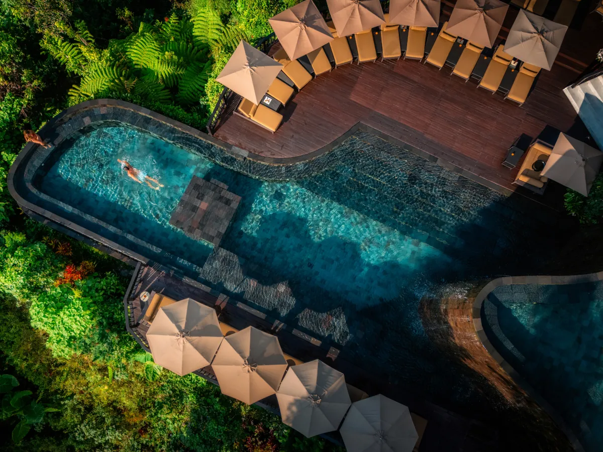 Couple in the infinity pool at Hanging Gardens of Bali romantic resort in Ubud